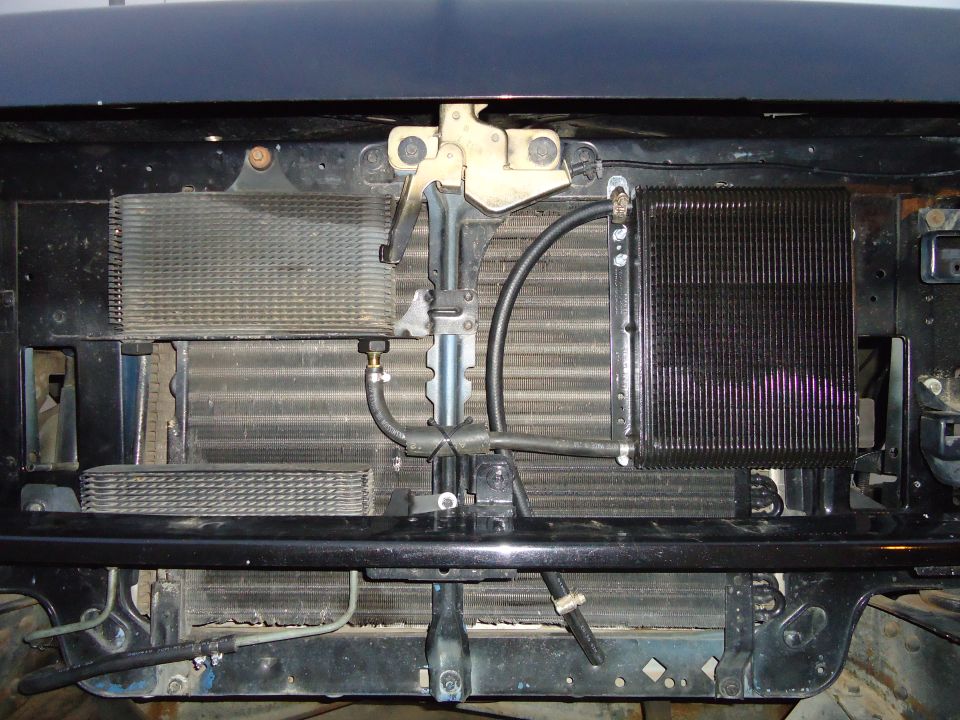 1987 Ford F-150 front end with visible radiators and hoses