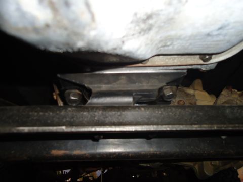 1987 Ford F-150 - A close-up shot of the undercarriage reveals structural components and fasteners, with a watermark indicating the source.