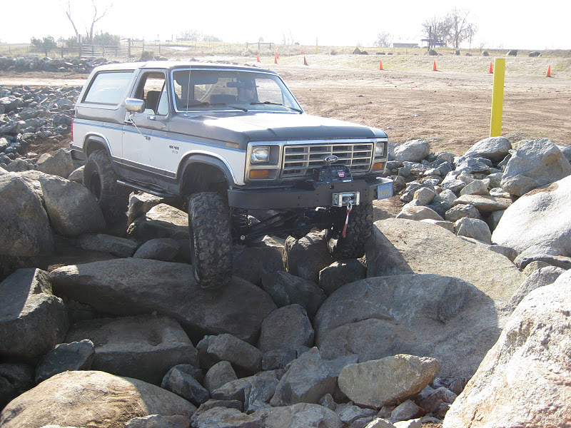 Ford Bronco with lifted suspension and winch on rocky terrain