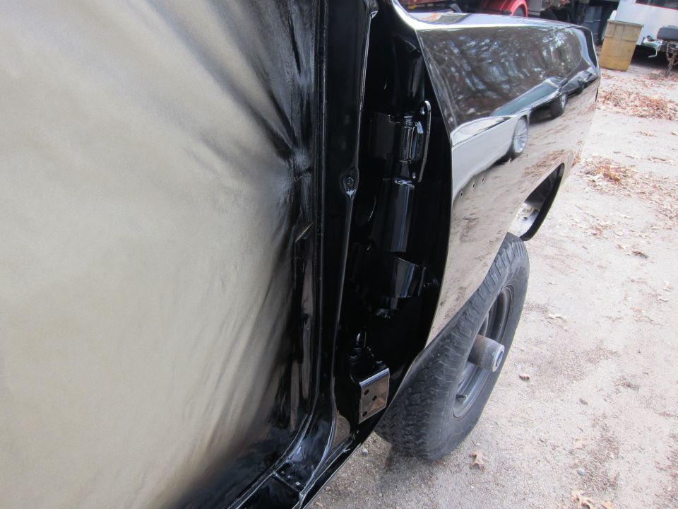 Black truck door hinge and interior panel. 1987 Dodge 1500