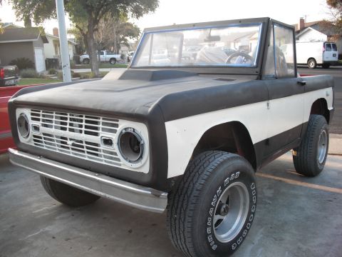 1968 Ford Bronco - This Ford Bronco is undergoing some modifications, evident by its hood scoop and two-tone paint scheme.
