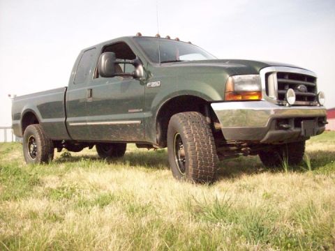 2000 Ford F-350 - This 2000 Ford F-350 pickup truck is shown from a 3/4 front angle in a grassy area.
