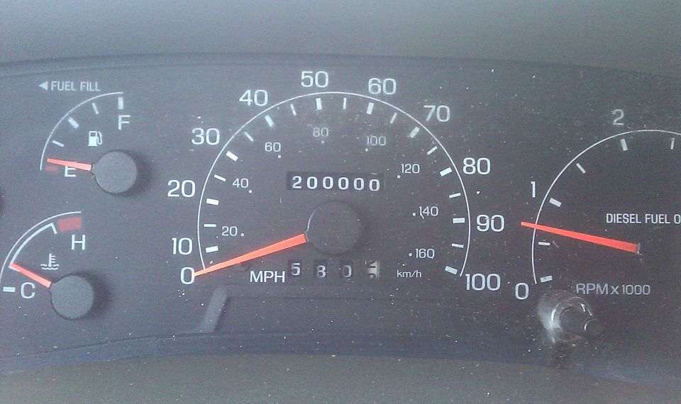 Dashboard gauges showing 200,000 miles, fuel, and temperature
