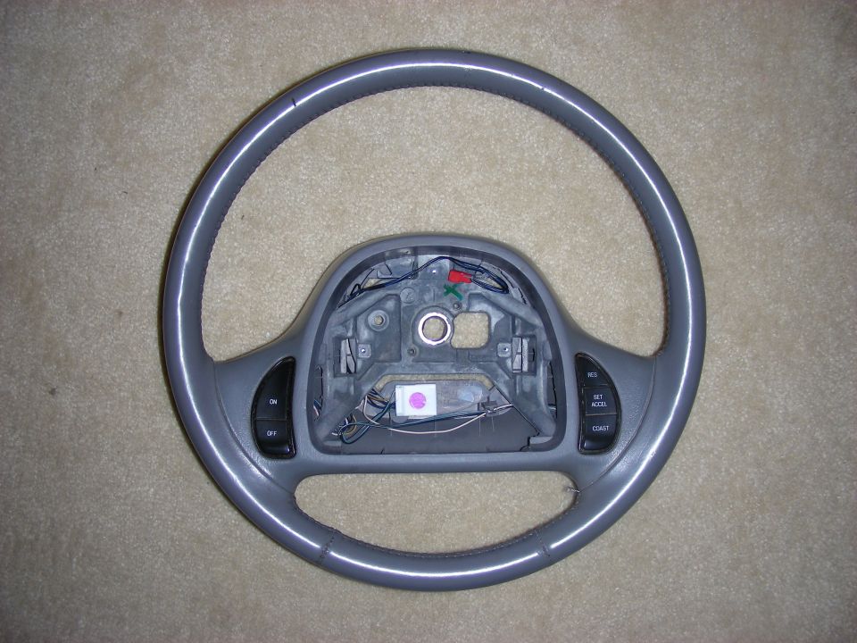 Steering wheel with cruise control buttons removed from vehicle