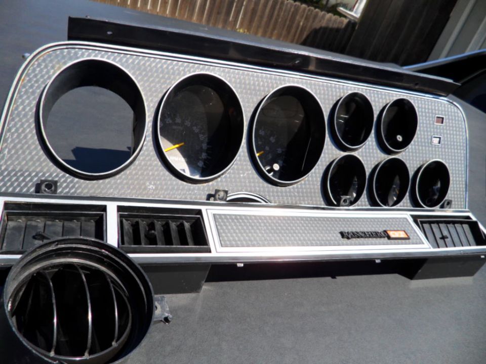 Dashboard instrument cluster with multiple gauges and air vents. Text reads 'Thunderbird'