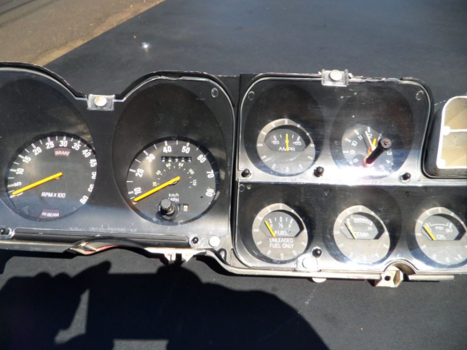 Dashboard instrument cluster with speedometer, tachometer, fuel, oil, and temperature gauges