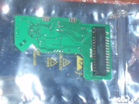 1996 Ford Bronco - Circuit board with warning symbols and connector visible.