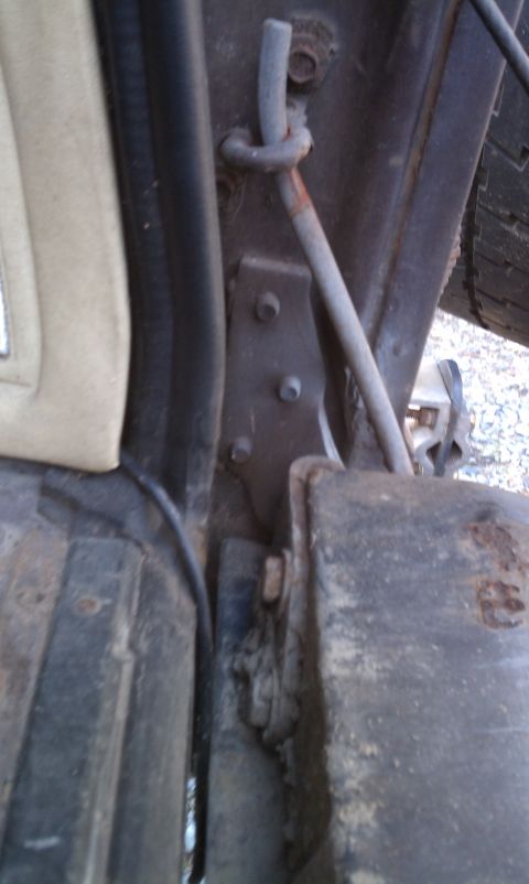 1979 Ford Bronco - Close-up view of the door hinge mechanism on a 1979 Ford Bronco.