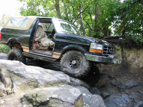 1994 Ford Bronco - This 1994 Ford Bronco is shown tackling a challenging off-road course on rocks.