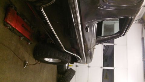 1979 Ford Bronco - A black SUV with chrome trim and large tires is shown from the side, appearing to be a 1978 model.