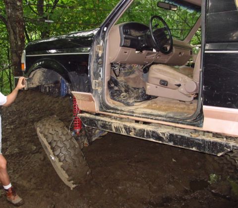 1994 Ford Bronco - This 1994 Ford Bronco is deep in the mud during an off-road excursion.