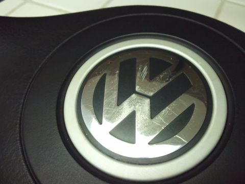 1989 Ford Bronco - The Volkswagen logo on the steering wheel shows significant scratching.