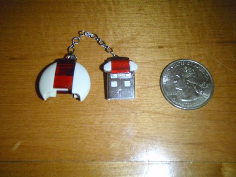 1996 Ford Bronco - A USB drive and a keychain fob are shown next to a quarter for scale.