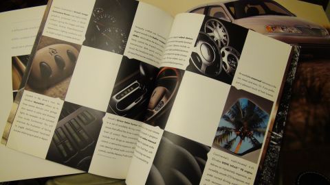 1993 Ford Taurus - This brochure displays various features of a car, including interior controls, wheel options, and a scenic reflection.