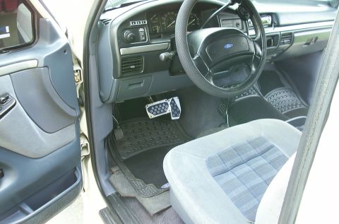 1993 Ford Bronco - Note steering wheel remote control for the CD player. Security: Can you see the plate below the black carpet under pedals?. It is a Securit…