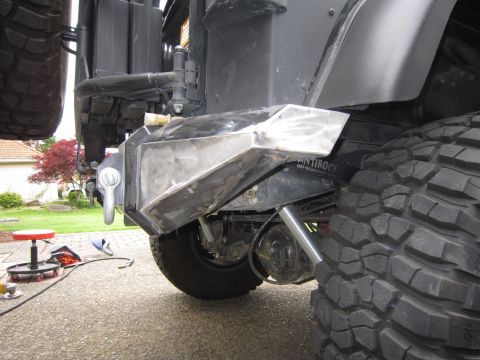 2008 Jeep Wrangler - Close-up of a custom rear bumper and off-road tire on a vehicle.