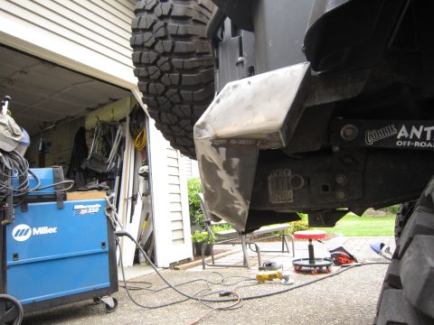 2008 Jeep Wrangler - Custom rear bumper fabrication in progress, a spare tire and "Currie Antirock Off-Road" branding.