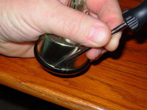 1975 Ford Bronco - Step 1 is to remove the swaged bezel ring. I just used a flathead screwdriver to pry the lip out all the way around.