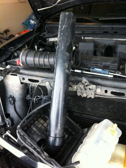 2010 Ford F-150 - Engine bay of a 2010 Ford F-150 with the air intake system partially disassembled.
