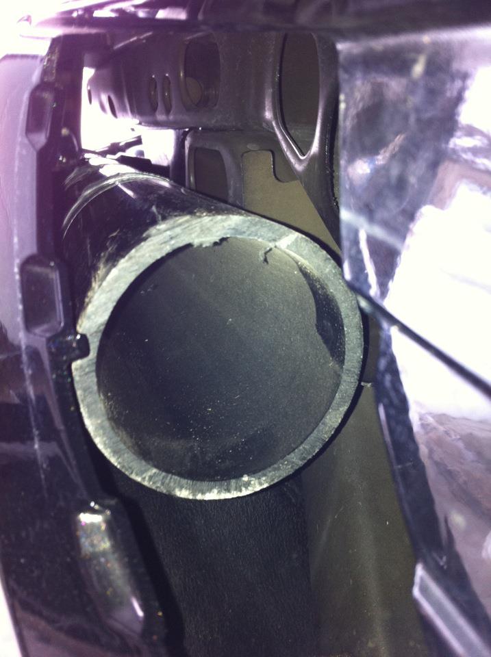 Exhaust pipe with rough edges, viewed from inside the opening