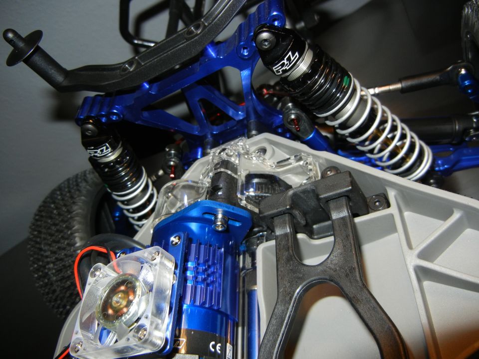 Blue suspension and motor assembly with RZ shocks on a remote control car