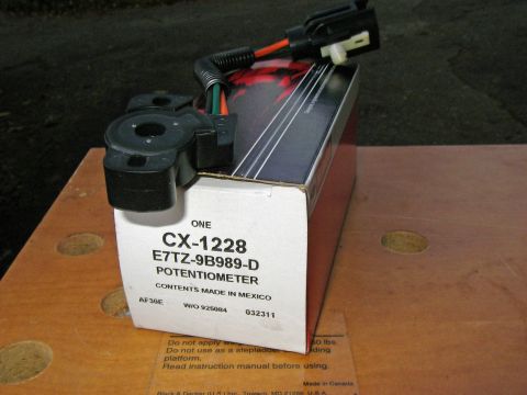 1990 Ford Bronco - A throttle position sensor potentiometer, part number CX-1228 E7TZ-9B989-D, is shown in its packaging.