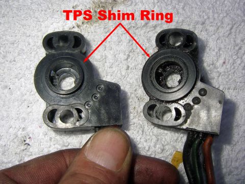 1990 Ford Bronco - Comparison of two throttle position sensor components, highlighting the TPS shim ring.