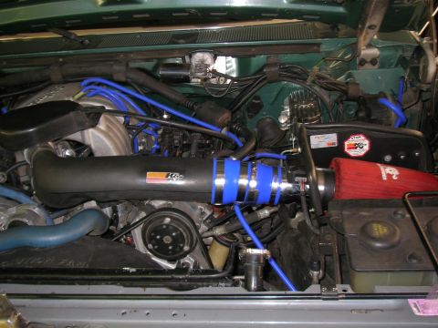1990 Ford Bronco - Engine bay features a K&N air intake system with blue silicone couplers and blue vacuum lines.