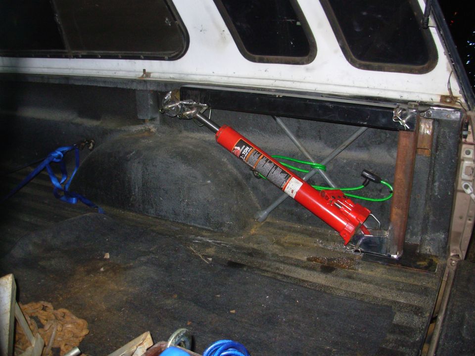 This is the main reason I built my own instead of buying one - storage, and accessibility.  It self-stows clear of the bed floor and below the bedrail.  I'll build another bracket to take the load off the jack, and to allow it to be locked down when the camper is off.  And everything it does can be done while the operator stands on the ground - no need to climb into & out of the bed.  I could add a small winch (manual or electric) to make it even more functional.