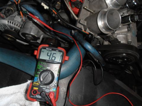 1990 Ford Bronco - A multimeter reads 4.61 volts while connected to various engine parts.