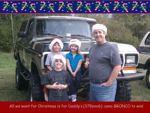 1979 Ford Bronco - A family celebrates Christmas in front of a lifted Ford Bronco, with another vehicle visible to the right.