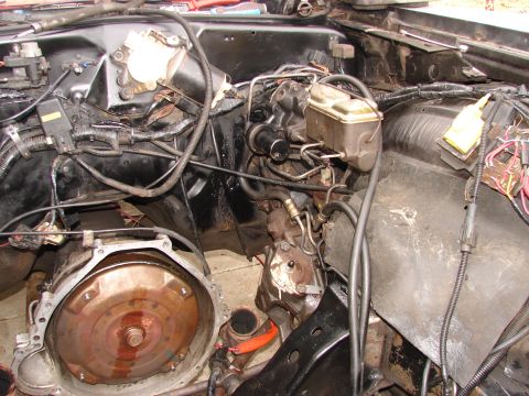 1973 Ford Ranchero - Close-up view of a vehicle's engine bay, showing various mechanical components and wiring.