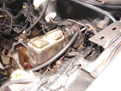1973 Ford Ranchero - Close-up of engine bay components, including the brake master cylinder and associated plumbing.