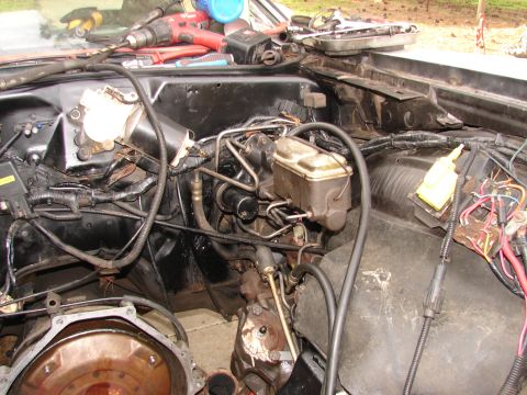 1973 Ford Ranchero - Close-up view of a vehicle's engine bay, showing the brake master cylinder and associated plumbing.
