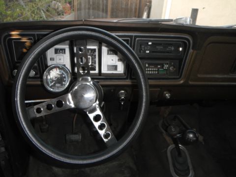 1979 Ford Bronco - Interior view of a 1979 Ford Bronco, an aftermarket steering wheel and dashboard.