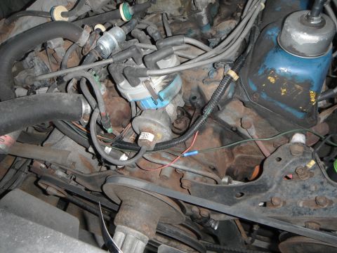 1979 Ford Bronco - Close-up view of a vehicle's engine bay, showing various components and wiring.