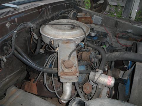 1979 Ford Bronco - Close-up view of an engine bay, showing various mechanical parts and wiring.