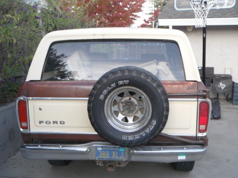1979 Ford Bronco - The rear of a 1979 Ford Bronco shows its spare tire, two-tone paint, and a California license plate.