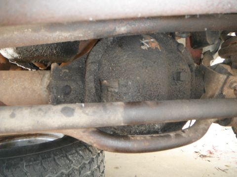 1979 Ford Bronco - Undercarriage view of a vehicle's differential and suspension system.