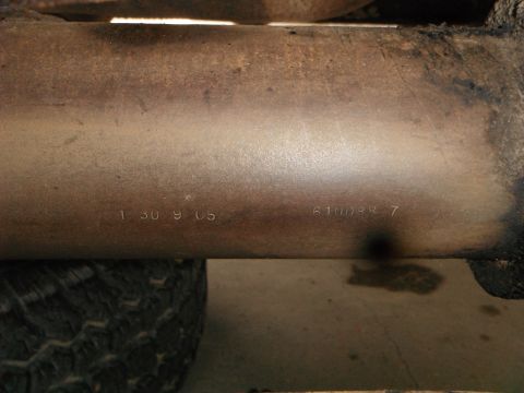 1979 Ford Bronco - Vehicle part with stamped identification numbers visible.