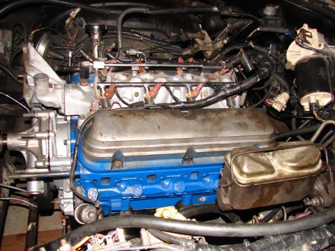 1973 Ford Ranchero - Close-up view of an engine bay, showing fuel injection system components and a painted engine block.