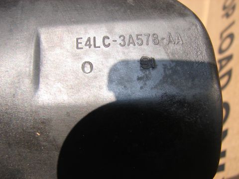 1973 Ford Ranchero - Close-up of a black plastic part showing embossed text E4LC-3A578-AA.