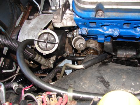 1973 Ford Ranchero - Engine bay detail with blue valve covers and various hoses and components visible.