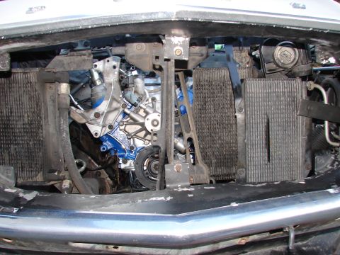 1973 Ford Ranchero - Close-up view of the engine bay, showing the engine block, radiators, and various hoses and components.