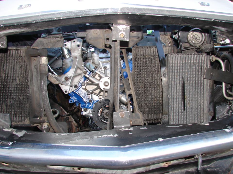 Engine bay with blue painted engine block and radiators