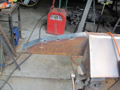 1982 Ford F-100 - Custom metal fabrication in progress, a welding project secured in a vise with a welding machine nearby.