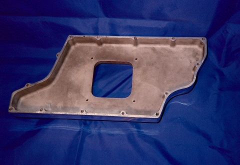 1973 Ford Mustang - An aluminum oil pan is shown from above on a blue surface.