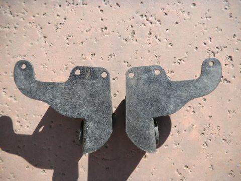 1997 Ford Ranger - Two black metal brackets are shown, each with two mounting holes and a curved extension.