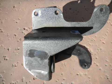 1997 Ford Ranger - Close-up of a metal bracket with a rubber bushing, likely a vehicle part.