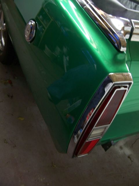 1971 Ford Ranchero - Rear view of a green 1971 Ford Ranchero, highlighting its distinctive taillight and chrome accents.